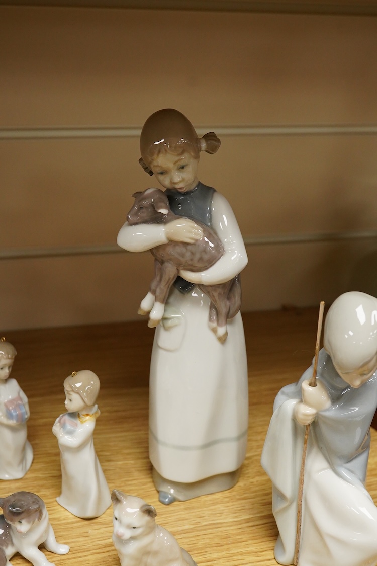 A group of twelve Lladro figures/animals, tallest 23cm